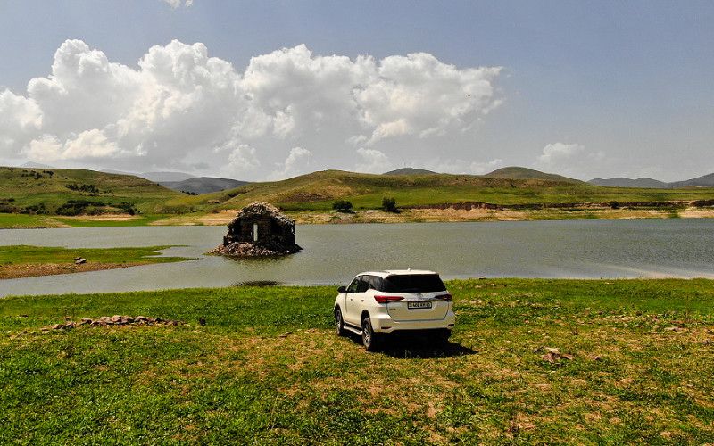 Armenia lake crossing road trip car rental adventure travel Caravan SUV